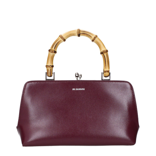 Jil Sander deep red leather handbag with sculptural curved top handle